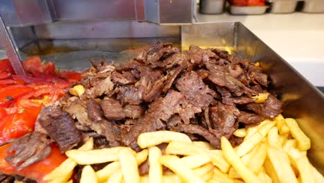 delicious doner kebab with french fries and tomatoes