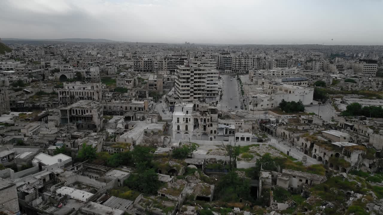 Drone flying over the streets of Aleppo, Syria. We can see buildings in ruins even 10 years after the civil war, with cars and people and the streets 4K