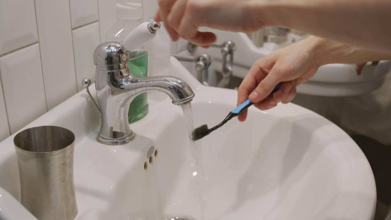 Unrecognizable Men Brushing Teeth