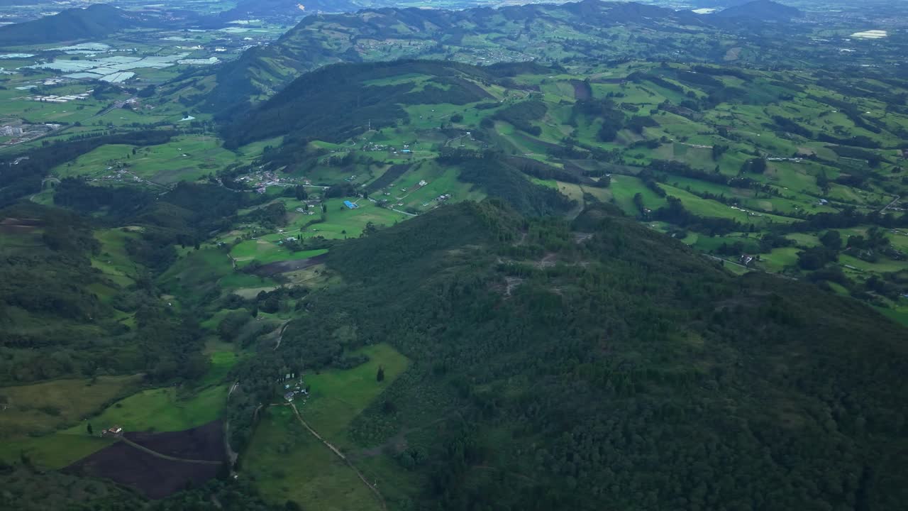 Scenic farmland in Zipaquira, Colombia, displaying rolling green hills