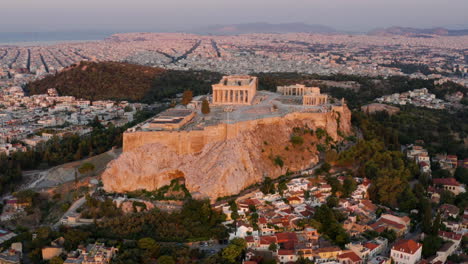 aerial view of acropolis of athens on rocky outcrop above city of athens in greece at sunrise