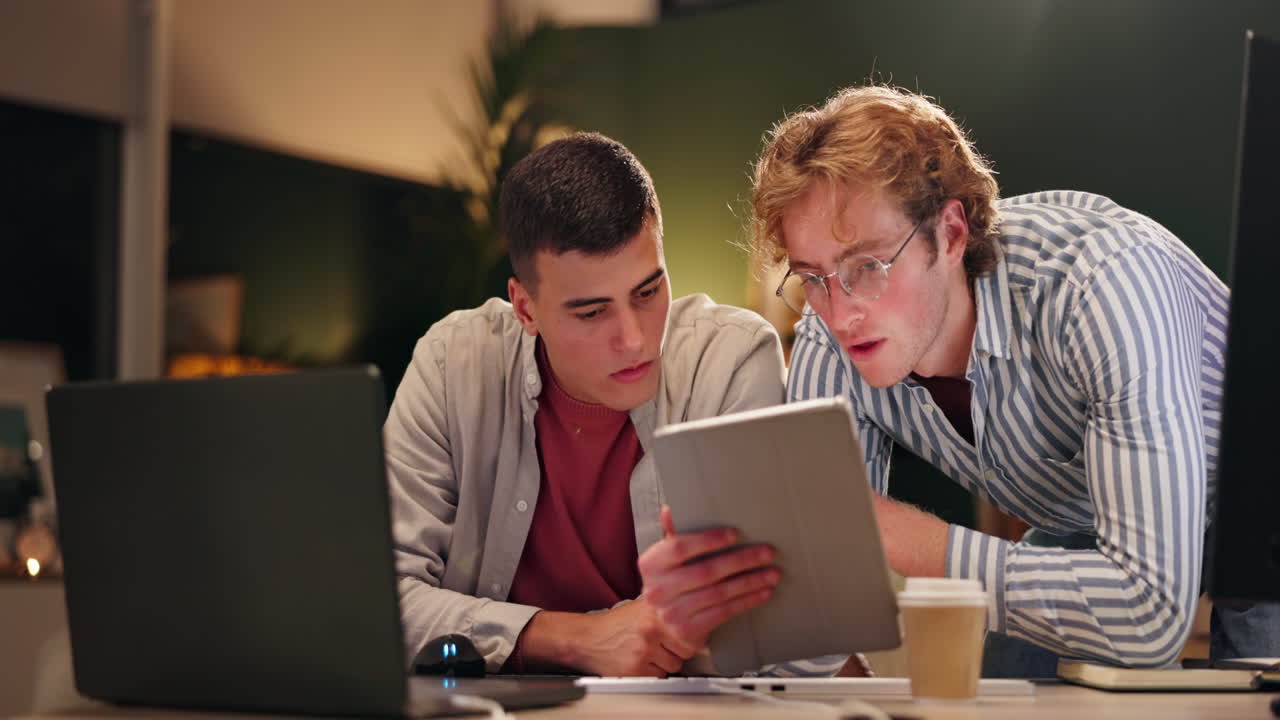 Two men working together in an office