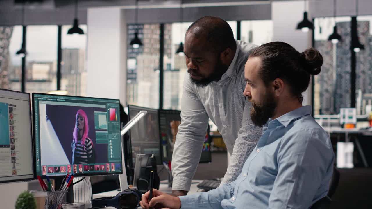 Diverse photographers works on image selection and retouching editing software