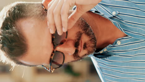 man in sunglasses and striped shirt