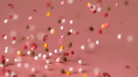 animation of balls falling over sprinkles on pink background