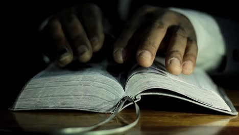 praying-to-god-with-bible-on-table-with-people-stock-video-stock-footage