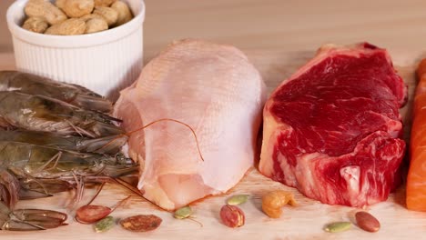 variety of meats, nuts, and dairy products shown