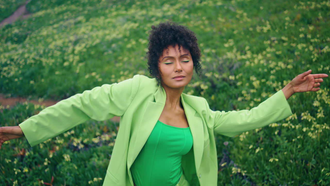 African girl dancer practicing sensual choreography on field close up vertical