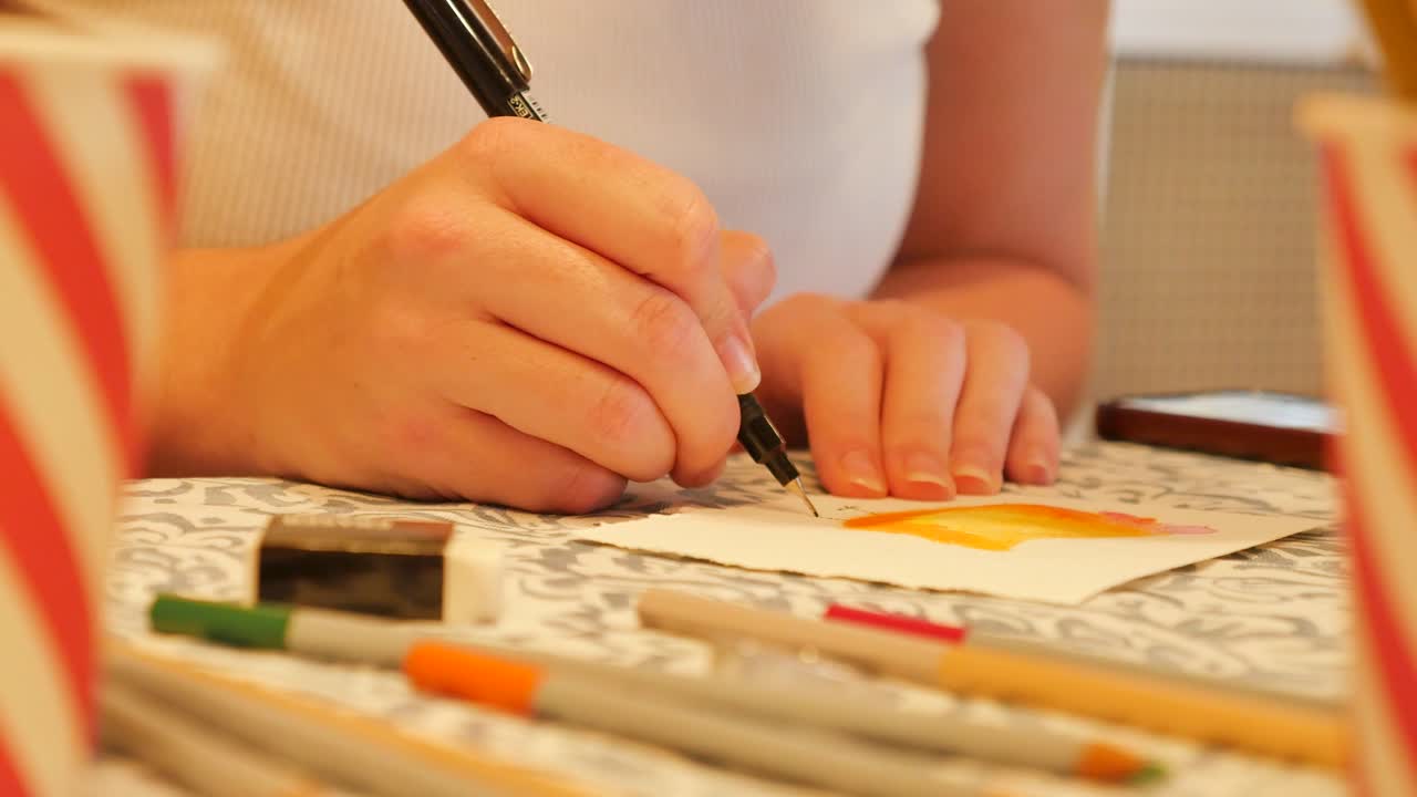 Drawing on a painting at table