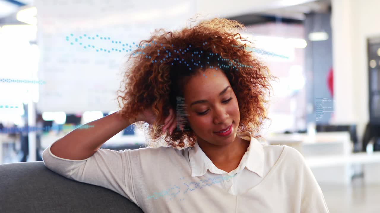 Woman on sofa shifting gaze, tucking hair, camera zooming causing HUD waveform appearing for tech