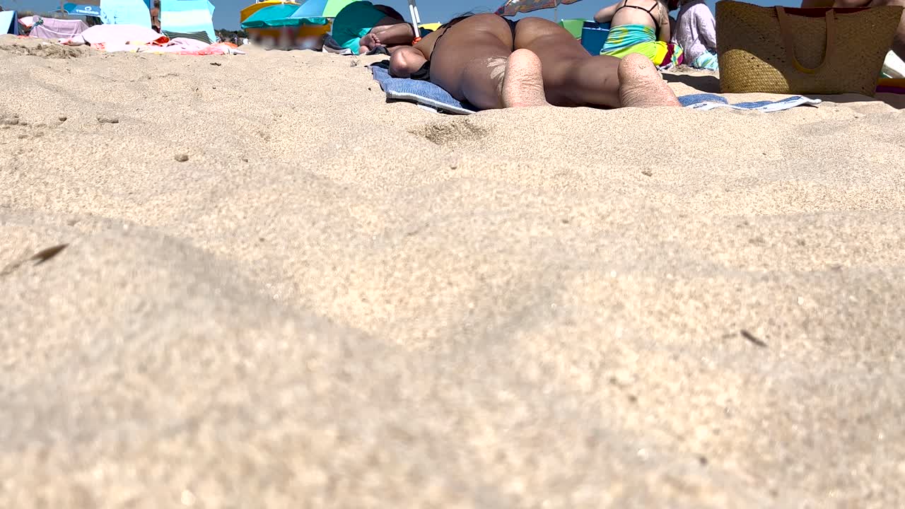 close-up view of a woman lying in the sun, relaxing and enjoying her summer vacation in Europe