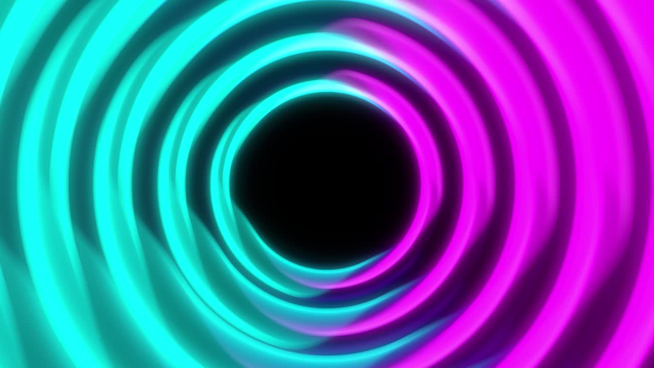 Continued rotation of the rings. The colors are blue and pink. Like a tunnel entrance.