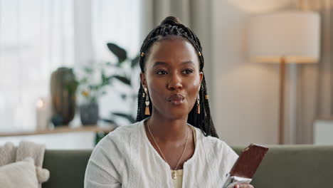 Home,-eating-and-black-woman-on-couch