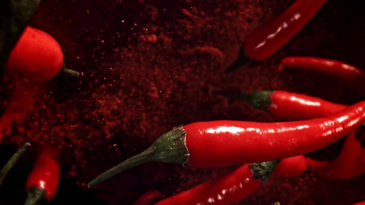 Vibrant Red Chili Peppers Falling with Spicy Powder