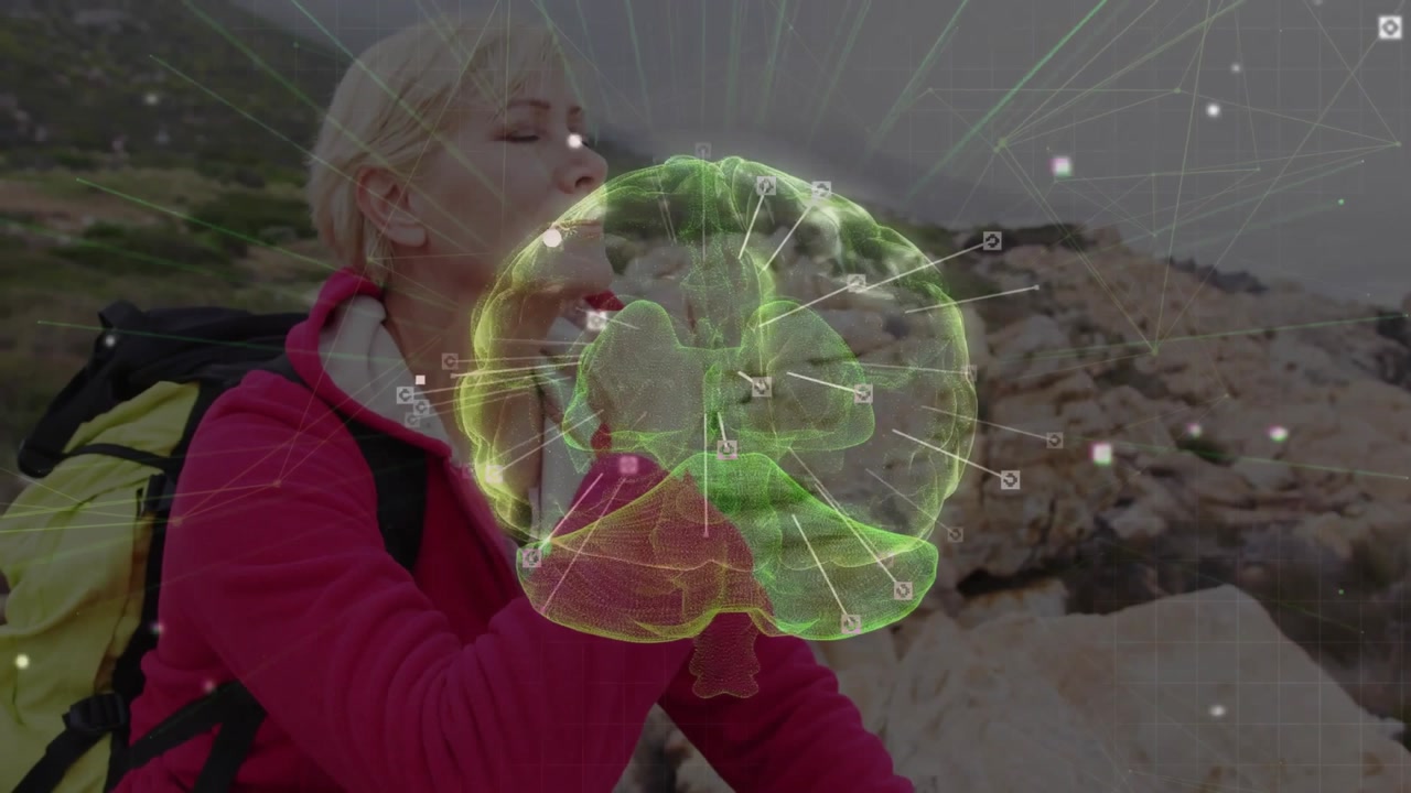 Woman hiker settling into pose on shore and exploring rotating brain hologram for medical education