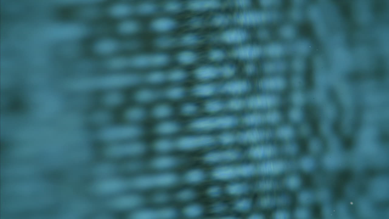 A retro TV displaying static noise, creating a nostalgic vintage atmosphere with blue and green hues.