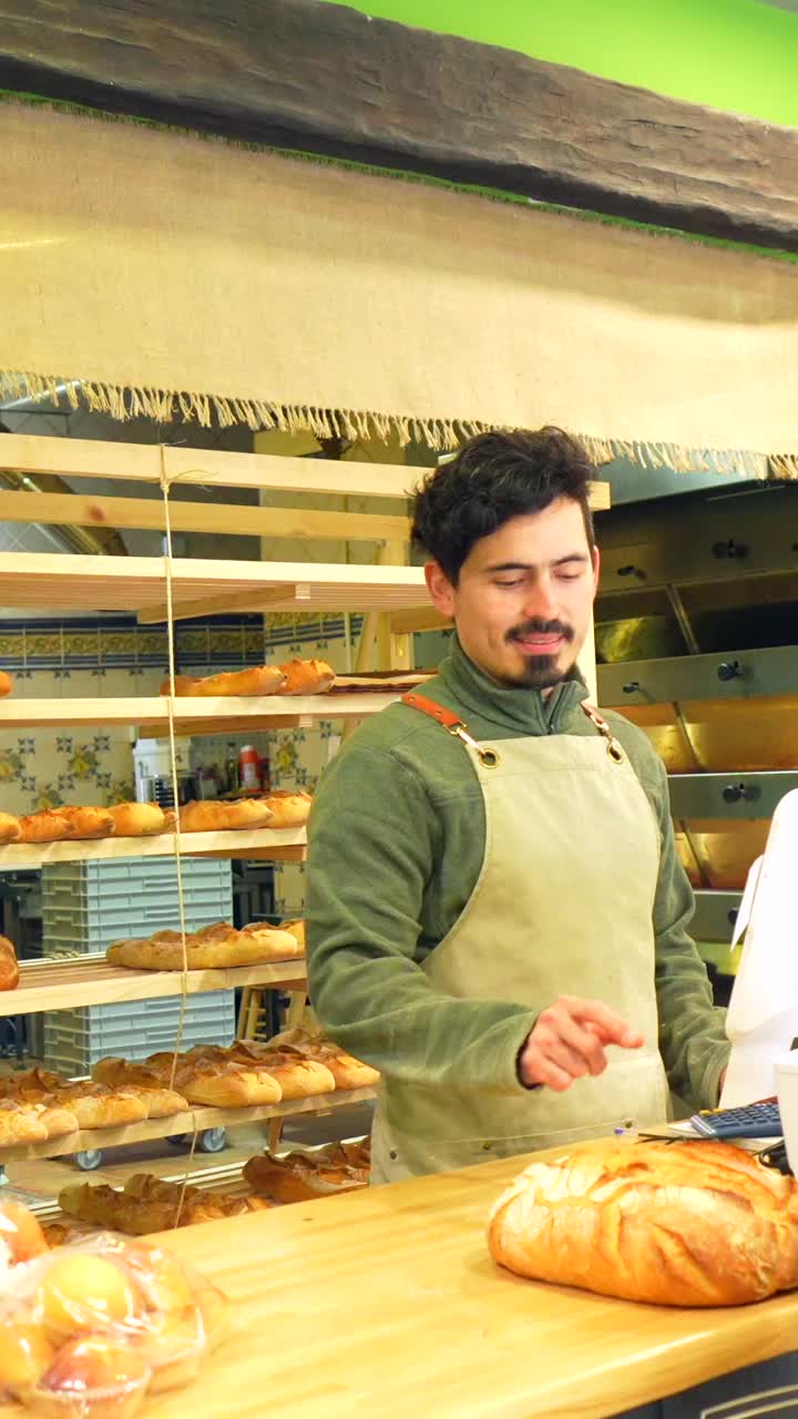 Customer paying at the bakery