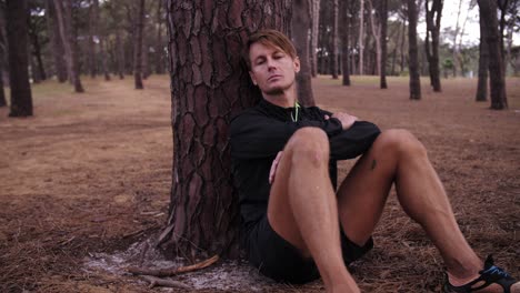 solo individual man with pine tree forest surrounding him