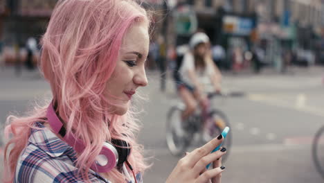 Slow-Motion-Portrait-of-caucasian-girl-with-pink-hair-using-smart-phone