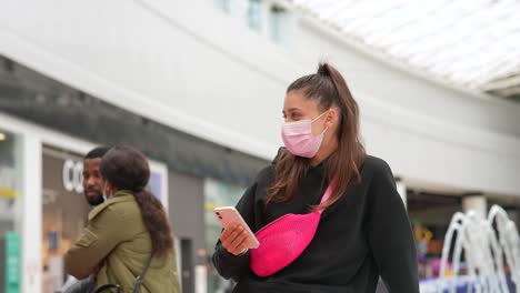 woman wearing mask in shopping mall