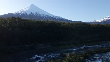 saltos del petrohue with volcan osorno at background in puerto varas, los lagos region of southern chile