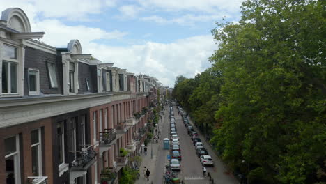 Establishing-Shot-of-Amsterdam-Street-on-Beautiful-Fall-Day-with-Clouds-and-Blue-Sky