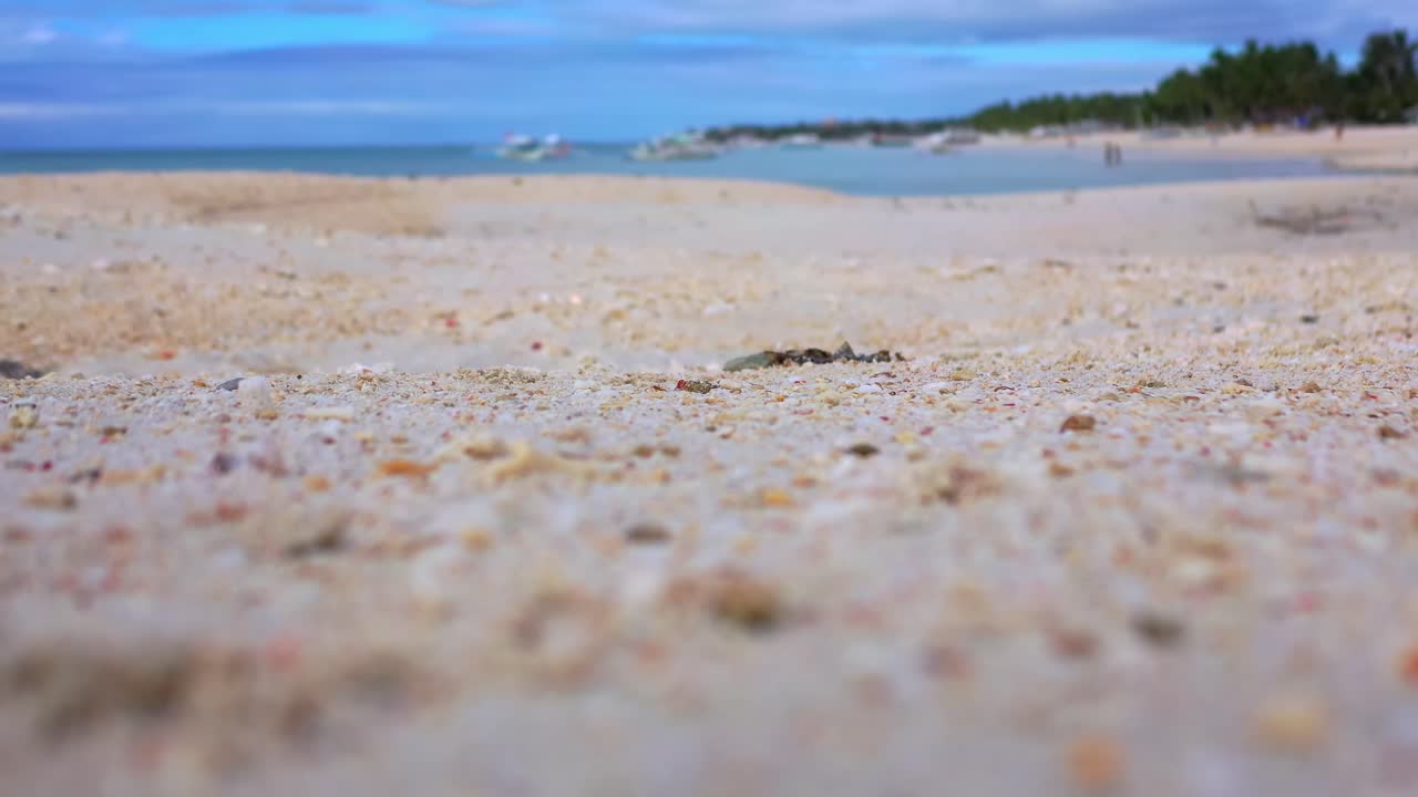 Beach scene with sand and shallow water
