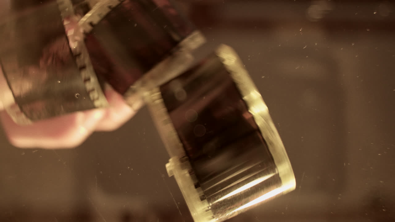 Hands Interacting with Analog Film Negatives