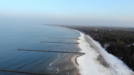 Aerial-shot-of-sandy-beach-in-Ustka-in-winter