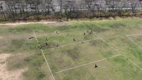 an aerial view over a park next to a parkway