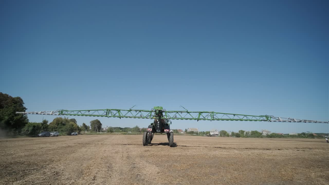 Tractor Spraying in Field