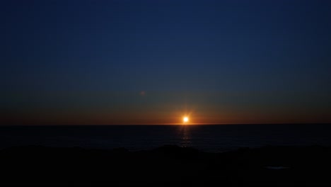 last sunset before midnight sun season time lapse. the sun moves horizontally over the sea. lofoten islands, northern norway.