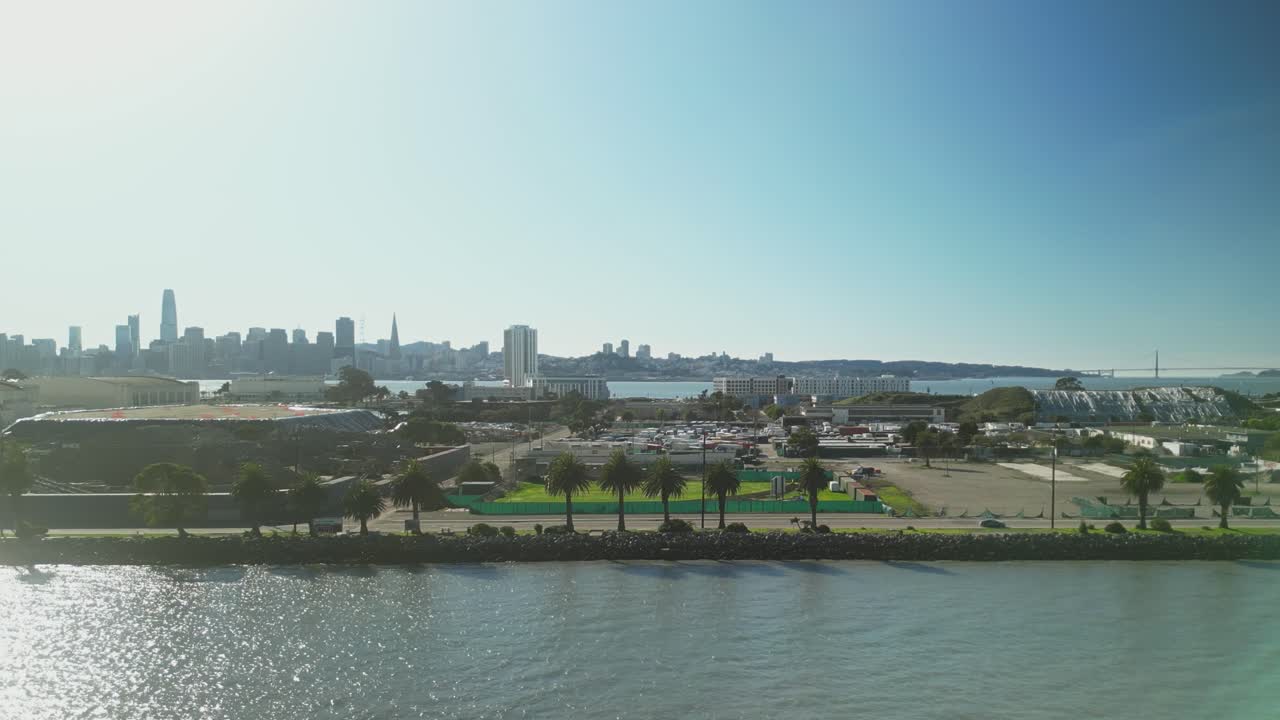 Pan drone shot of Treasure Island in the day with San Francisco cityscape in California, USA