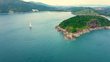 Drone-footage-aerial-top-view-of-catamaran-sailing-in-the-open-sea