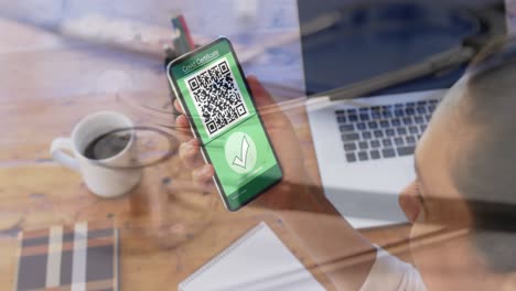 Composition-of-woman-holding-a-smartphone-with-qr-code-on-screen-against-stethoscope-on-a-table