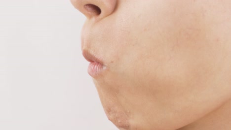 close-up portrait of woman eating green apple. eat fruit.