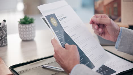 a person reviewing a resume