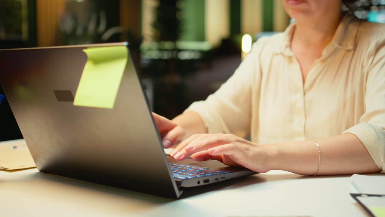 Vertical Video Close up of woman spends the night transcribing key points