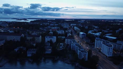 Street-lamps-suddenly-illuminate-on-dusk-blue-hour-Helsinki-flyover