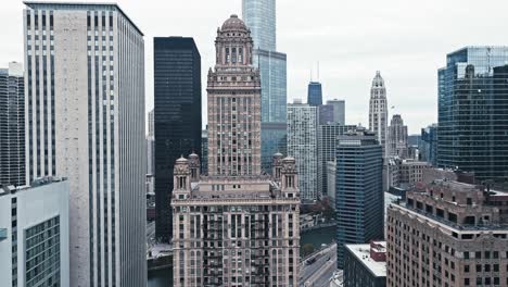 aerial overview of the tower framed by other high-rise buildings in downtown chicago