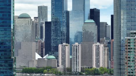 Tight-long-zoom-aerial-shot-of-lower-Manhattan-skyscraper-tower-buildings-in-financial-district