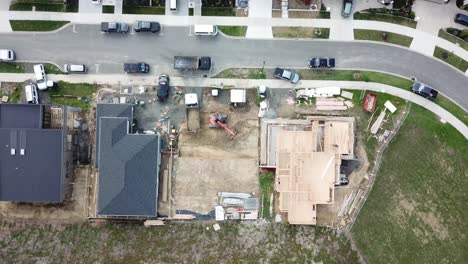 aerial top view of a new suburb, with new houses building in progress