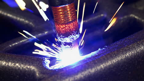 close-up of industrial welding process with bright sparks