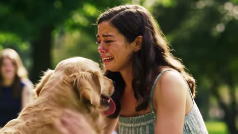 a heartfelt reunion: an emotional moment between a woman and her beloved dog captured in a touching scene of love and comfort beneath the trees