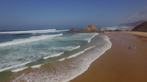 the surf beach of castelejo, portugal. aerial shot