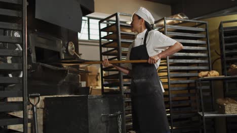 animation of asian female baker putting rolls into furnace