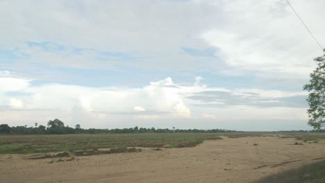 Wide-stretch-of-sacred-Falgu-River-dry-waterbed-with-a-long-stretch-of-sand-dunes,-Bodhgaya,-Bihar,-India