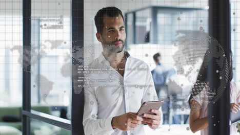 Animation-of-spinning-globe-and-data-processing-over-middle-eastern-man-using-tablet-at-office