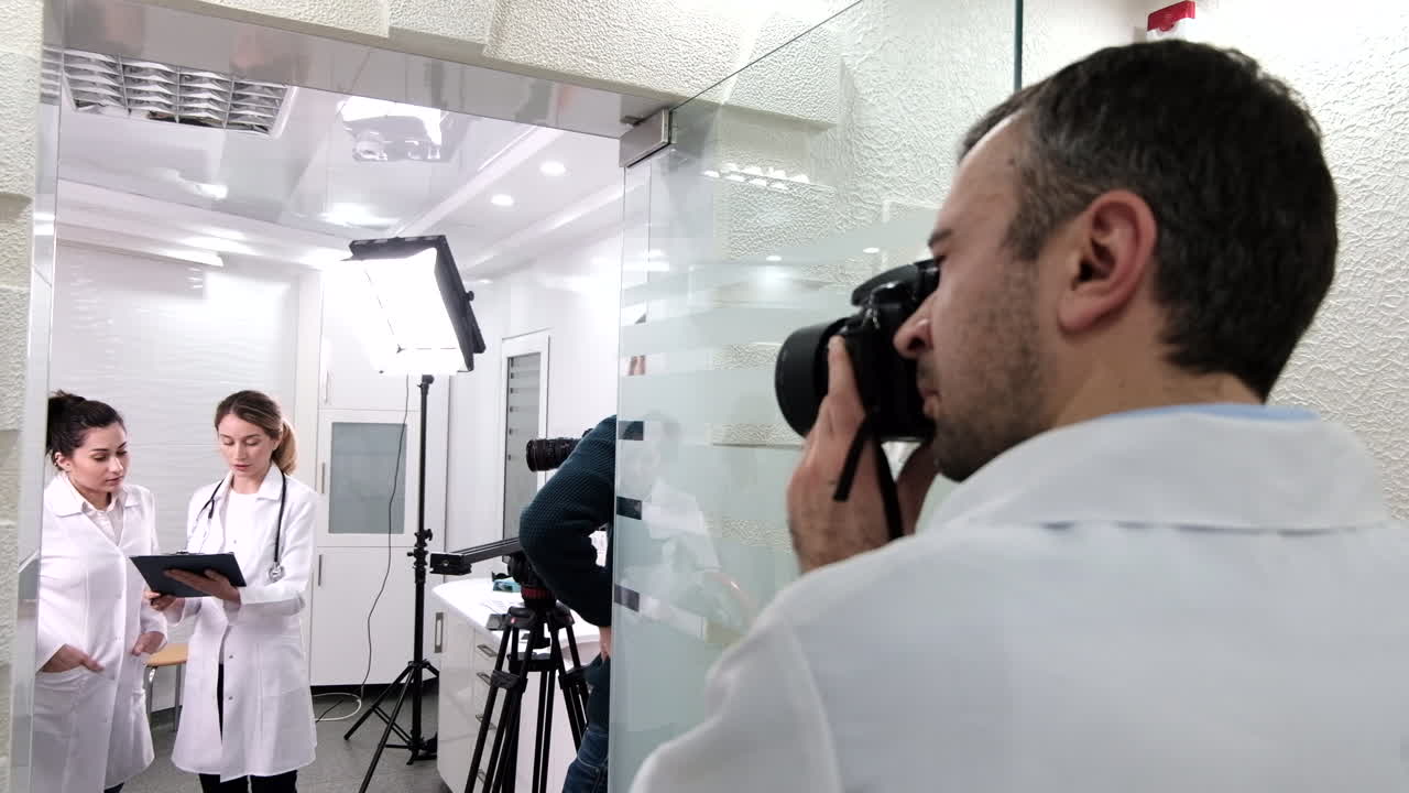 CHISINAU, MOLDOVA - 10 SEPTEMBER, 2018: Backstage of shooting session at the dental cabinet, photographers and videographers at work