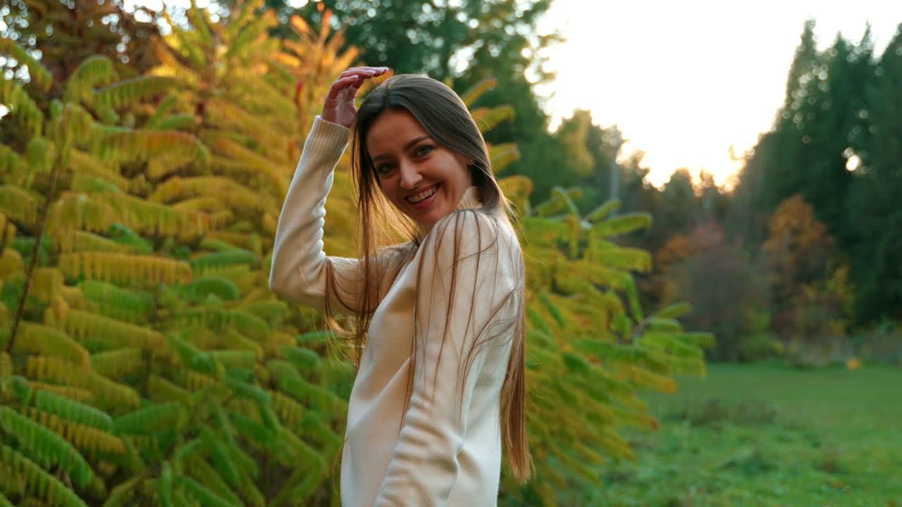Woman Smiling in Autumn Park
